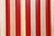 Vertically arranged boards on a red background