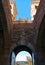Verticals shot of an arch going under the buildings in Toledo, Spain