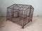 A very antique cage for pets