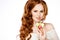 Very beautiful girl with gorgeous red hair holding an Orchid, be