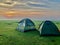 Very beautiful green nature with cloud sky and tent