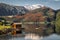 Very calm lake with a fisherman`s cottage