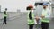 Very charismatic woman and good looking engineer have a conversation on the rooftop of the building construction site