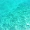 Very clear turquoise water with rocks at bottom