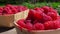 Very close up of raspberries in the wicker baskets