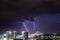 Very cloudy sky, lightning and thunder above the Belgrade sky, panoramic view of the city and the river with bridges. Belgrade is