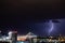 Very cloudy sky, lightning and thunder above the Belgrade sky, panoramic view of the city and the river with bridges. Belgrade is