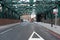 A very cool street with green metallic building stabilisers, Uk