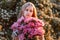 Very cute teenage girl with flowers in a red sundress posing