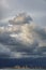 Very dark stormy clouds over port cranes