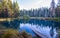 Very deep wild Little Crater Lake with clear blue water in Oregon