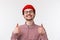 Very good. Close-up portrait satisfied handsome young man with moustache, wear red beanie and glasses, close eyes and
