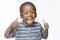 Very happy African black boy making thumbs up sign with hands laughing happily African ethnicity black boy isolated on white