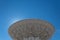 Very Large Array backlit radio astronomy observatory dish in clear sky, science technology space