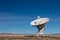 Very Large Array Distant view of radio antenna against a blue sky, gold fields and purple mountains