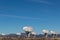 Very Large Array grouping of radio antenna dishes in New Mexico desert, blue sky