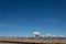 Very Large Array multiple radio antenna dish telescopes against a blue sky in the New Mexico desert near Magdalena