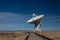 Very Large Array path to a radio antenna dish of the VLA in the New Mexico desert, space astronomy technology