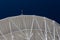 Very Large Array structure under a large radio telescope antenna dish at the VLA in New Mexico