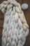 Very large knitting of white sheep wool