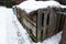 Very large three section wooden compost box standing garden in winter at countryside for ecological composting of food and garden