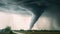 a very large tornado is in the sky over a road