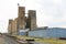 Very large working agricultural farm community feed grain and corn silo building next to railroad track in rural heartland america