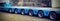 Very long blue truck with six axles of wheels with vintage effe