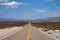 Very long, empty road stretching through the desert in Nevada