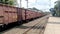 A very long goods train freight train or cargo train TKD WAG â€“ Tuglakabad Of Indian Railways Passing Suburban Railway Station