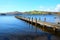 Very long symetrical beautiful wooden jetty, jutting out from th