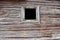 Very old antique barn wall with a window