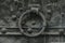 Very old black church door with a ring knocker