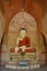 Very old Buddha sculpture inside pagoda in Bagan, Myanmar. Ancient frescos on the walls of pagoda.