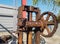 Very old factory gear, antique factory machinery with cogged wheels that rust