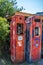 Very old gasoline pumps beside a 2 lane road in the middle of nowhere