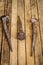 very old large nails on a beautiful wooden background, rusty