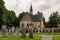 Very old Luss Parish Church dedicated to Saint Kessog with a graveyard in front of it