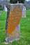 Very old mold covered broken statue / headstone in a cemetery