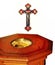 Very old wood baptism font with cross showing the Holy Trinity