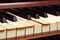 Very old wooden piano with ivory keys broken