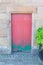 Very rustic green and red door