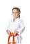 Very serious little girl in a kimono with orange belt