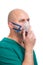 Very Sick Man Doing Inhalation Through Oxygen Mask At Hospital, isolated on white