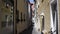 A very small and narrow lonely street in the historic center of Regensburg Germany in the summer.