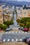 Very steep roads downtown in San Francisco lined with colorful buildings