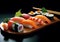 Very tasty sushi served in a professional way against a black background.