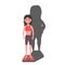 very thin woman with a mental disorder of anarexia and bulimia stands on the scales, feeling fat, feeling a fat shadow behind her