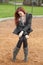 Very Unhappy Young Woman with Beautiful Auburn Hair on a Swing