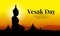Vesak day banner with Silhouette Big Buddha statue in temple and mountain on yellow orange sky vecto design